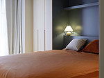 115平米现代简约风二室卧室装修效果图，软装创意设计图